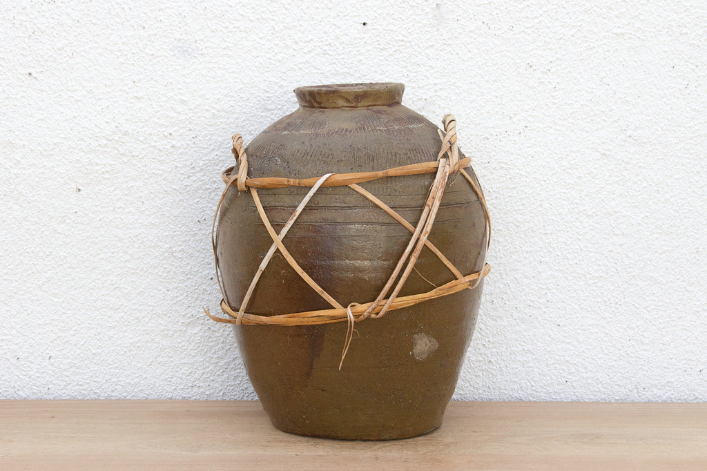 Antique Asian Stoneware Pot with Rattan Harness