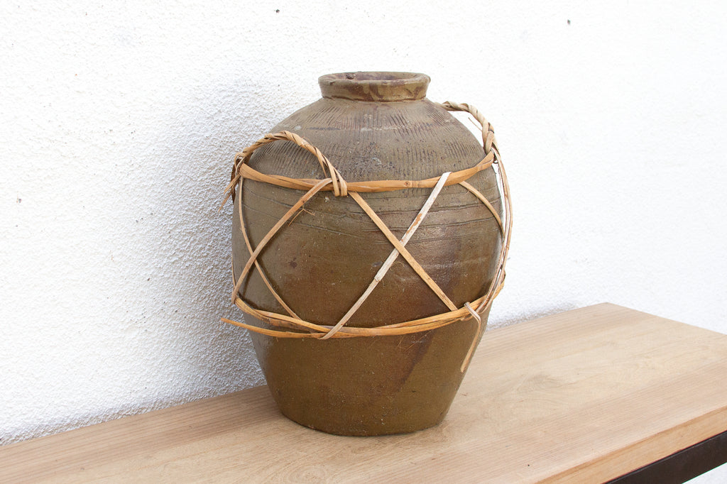 Antique Asian Stoneware Pot with Rattan Harness
