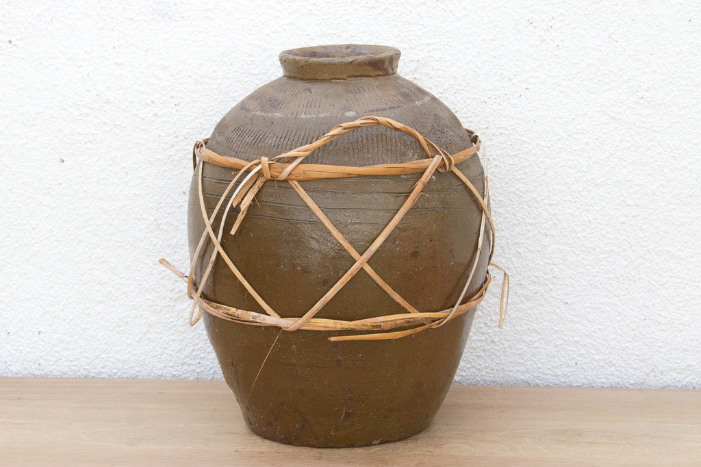 Antique Asian Stoneware Pot with Rattan Harness