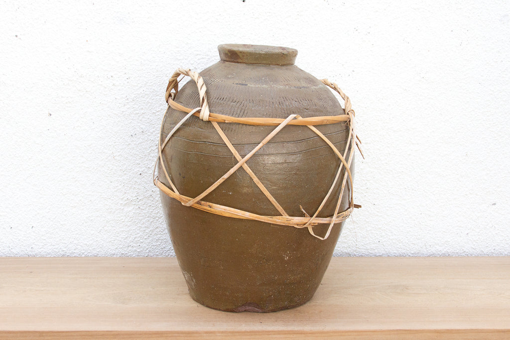 Antique Asian Stoneware Pot with Rattan Harness