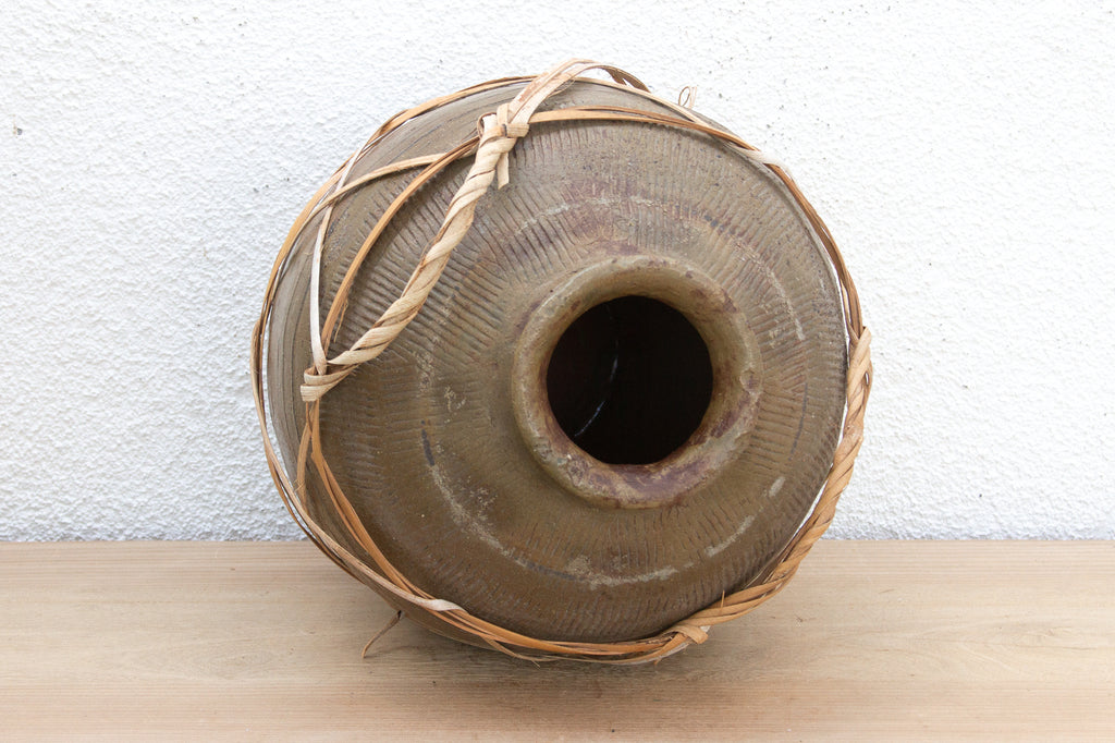 Antique Asian Stoneware Pot with Rattan Harness
