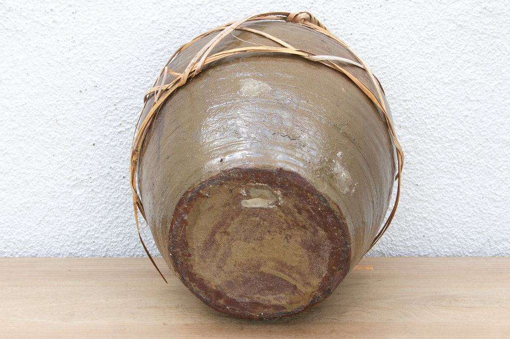 Antique Asian Stoneware Pot with Rattan Harness