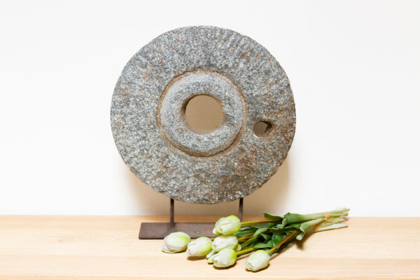 Carved Gray Millstone on Stand