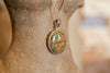 Round Rhyolite Pendant with Silver Chain (Trade)